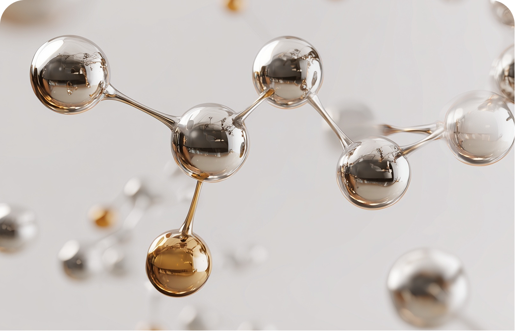 Reflective chrome and gold molecule model on a light background